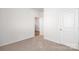 Bedroom featuring neutral carpeting and two doors at 130 Woodhall Way, Troutman, NC 28166