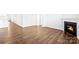 Spacious living room featuring hardwood floors and a cozy fireplace at 130 Woodhall Way, Troutman, NC 28166