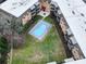 Aerial view of a complex featuring a pool, green spaces, and multi-story buildings at 1323 Queens Rd # 424, Charlotte, NC 28207