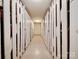 Basement storage area with rows of white storage racks with ample storage space at 1323 Queens Rd # 424, Charlotte, NC 28207