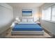 Cozy bedroom featuring a large bed, matching nightstands, and ample natural light at 1323 Queens Rd # 424, Charlotte, NC 28207