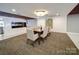 Well-lit dining area with modern chairs and decor with a full view of the lounge at 1323 Queens Rd # 424, Charlotte, NC 28207