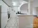 Efficient kitchen with white cabinetry at 1323 Queens Rd # 424, Charlotte, NC 28207