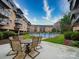 Patio area featuring a pool, an outdoor table, and seating at the apartment complex at 1323 Queens Rd # 424, Charlotte, NC 28207