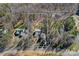 Aerial view of a beautiful house and lot surrounded by trees, featuring approximate lot lines at 15314 Logan Grove Rd, Charlotte, NC 28227