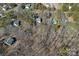 An aerial shot showing several houses amid a dense forest and community streets at 15314 Logan Grove Rd, Charlotte, NC 28227