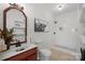 Charming bathroom featuring a vanity with black fixtures and a tile shower with a decorative accent at 15314 Logan Grove Rd, Charlotte, NC 28227