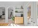 Charming butler's pantry with open shelving that connects the dining area and living room at 15314 Logan Grove Rd, Charlotte, NC 28227