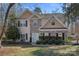 Charming two-story home featuring stone accents, black shutters, and a light blue front door at 15314 Logan Grove Rd, Charlotte, NC 28227