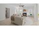 Bright living room with a fireplace, multiple windows and tile flooring at 15314 Logan Grove Rd, Charlotte, NC 28227