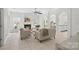 Spacious living room featuring a fireplace, tile flooring, and arched doorways at 15314 Logan Grove Rd, Charlotte, NC 28227