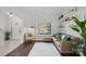 Inviting living room with a comfortable sofa and a sun-filled window at 15314 Logan Grove Rd, Charlotte, NC 28227