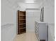 Functional walk-in closet with shelving, rods, and storage solutions for organized living at 15314 Logan Grove Rd, Charlotte, NC 28227