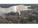 Aerial view of lake community home nestled amongst trees at 1665 Sherwood Ct, Sherrills Ford, NC 28673