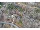 Beautiful aerial view of a community with mature trees surrounding homes and pond at 1665 Sherwood Ct, Sherrills Ford, NC 28673