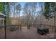 Spacious back deck provides views of the surrounding wooded landscape and a place for outdoor relaxation at 1665 Sherwood Ct, Sherrills Ford, NC 28673