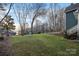 A well-maintained lawn slopes towards a view of the lake and surrounding landscape at 1665 Sherwood Ct, Sherrills Ford, NC 28673