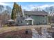 Beautiful backyard featuring a spacious deck, lush landscaping, and stone pathway perfect for outdoor gatherings at 1665 Sherwood Ct, Sherrills Ford, NC 28673