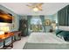 Bright bedroom features desk, curtains, large window, and bed with throw pillows at 1665 Sherwood Ct, Sherrills Ford, NC 28673