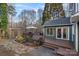 Expansive wooden deck with a pergola, outdoor seating, and lovely landscaping offers a relaxing retreat at 1665 Sherwood Ct, Sherrills Ford, NC 28673