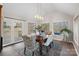 Elegant dining room with vaulted ceilings, large windows, and stylish chandelier at 1665 Sherwood Ct, Sherrills Ford, NC 28673