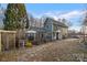 Charming two-story home boasts a spacious deck, stone pathway, and lush landscaping, perfect for outdoor living at 1665 Sherwood Ct, Sherrills Ford, NC 28673