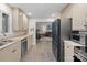 Modern kitchen featuring stainless steel appliances and seamless transition to the cozy living area at 1665 Sherwood Ct, Sherrills Ford, NC 28673