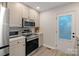 Clean kitchen with stainless steel appliances, modern oven, and convenient access to the door at 1665 Sherwood Ct, Sherrills Ford, NC 28673