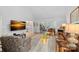 Open-concept living room with modern decor, fireplace, and seamless flow to the kitchen and dining area at 1665 Sherwood Ct, Sherrills Ford, NC 28673