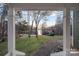 Inviting view from the front porch showcasing the expansive lawn and serene lake in the distance at 1665 Sherwood Ct, Sherrills Ford, NC 28673