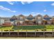 Townhomes overlook a scenic backyard with a waterfront view from the property's private deck at 18409 Harborside Dr, Cornelius, NC 28031