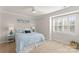 A cozy bedroom with a queen bed, shutters, and neutral paint offers a relaxing, serene space at 18409 Harborside Dr, Cornelius, NC 28031