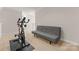 A bonus room featuring neutral walls, carpet and futon, with an exercise bike in the corner of the room at 18409 Harborside Dr, Cornelius, NC 28031