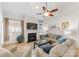The living room features a cozy fireplace, a large sectional sofa, and bright windows with plantation shutters at 18409 Harborside Dr, Cornelius, NC 28031