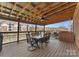 Covered outdoor patio with dining area and lake views at 18409 Harborside Dr, Cornelius, NC 28031