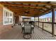 Covered outdoor patio with dining area and backyard views at 18409 Harborside Dr, Cornelius, NC 28031