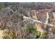 An aerial view of a charming single Gathering home surrounded by mature trees in a secluded neighborhood at 19320 Davidson Concord Rd, Davidson, NC 28036