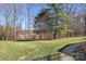 Spacious, well-manicured backyard featuring a lush lawn and a beautiful view of the surrounding landscape at 19320 Davidson Concord Rd, Davidson, NC 28036