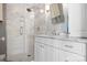 Bathroom features a glass shower with marble tile and a modern vanity at 19320 Davidson Concord Rd, Davidson, NC 28036