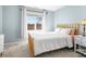 Bedroom with a large window, carpet floors, and a modern bed at 19320 Davidson Concord Rd, Davidson, NC 28036