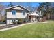 Attractive two-story home with well-maintained landscaping, a walkway, and a welcoming front entrance at 19320 Davidson Concord Rd, Davidson, NC 28036