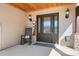Cozy front porch with a welcome sign, a rocking chair, and charming details at 19320 Davidson Concord Rd, Davidson, NC 28036
