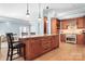 Open kitchen with large island, stainless steel appliances and hardwood floors at 19320 Davidson Concord Rd, Davidson, NC 28036