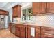 Gourmet kitchen features custom cabinets, granite counters, and stainless steel appliances at 19320 Davidson Concord Rd, Davidson, NC 28036