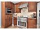 Close up of gourmet kitchen with stainless steel appliances and custom backsplash at 19320 Davidson Concord Rd, Davidson, NC 28036