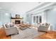 Comfortable living room features a stone fireplace, hardwood floors, and neutral color palette at 19320 Davidson Concord Rd, Davidson, NC 28036
