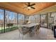 Enjoy the outdoors in this covered patio with a ceiling fan and a lovely table with seating at 19320 Davidson Concord Rd, Davidson, NC 28036