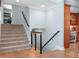 Beautiful staircase with wooden railings and access to the upper floors at 19320 Davidson Concord Rd, Davidson, NC 28036