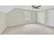 Bedroom with neutral carpet, a ceiling fan, and two closets at 2041 Jefferson Ave, Gastonia, NC 28056