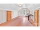 Bright bonus room featuring hardwood floors, natural light from a window, and built-in table/shelving at 2041 Jefferson Ave, Gastonia, NC 28056